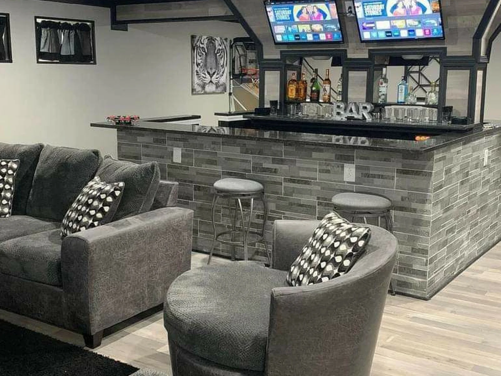 Basement man cave renovation with new flooring and lighting in Moore by MASB Construction