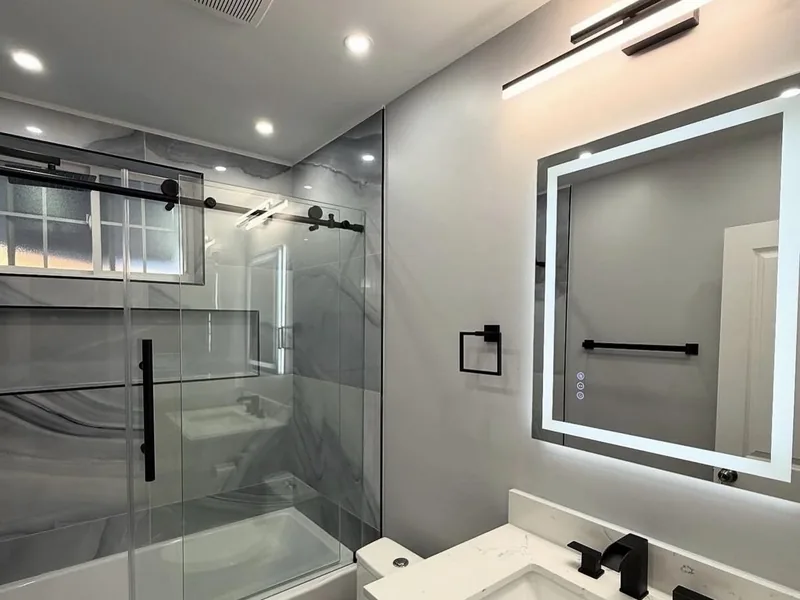 Modern bathroom renovation in Edmond, Oklahoma by MASB Construction & Remodeling LLC