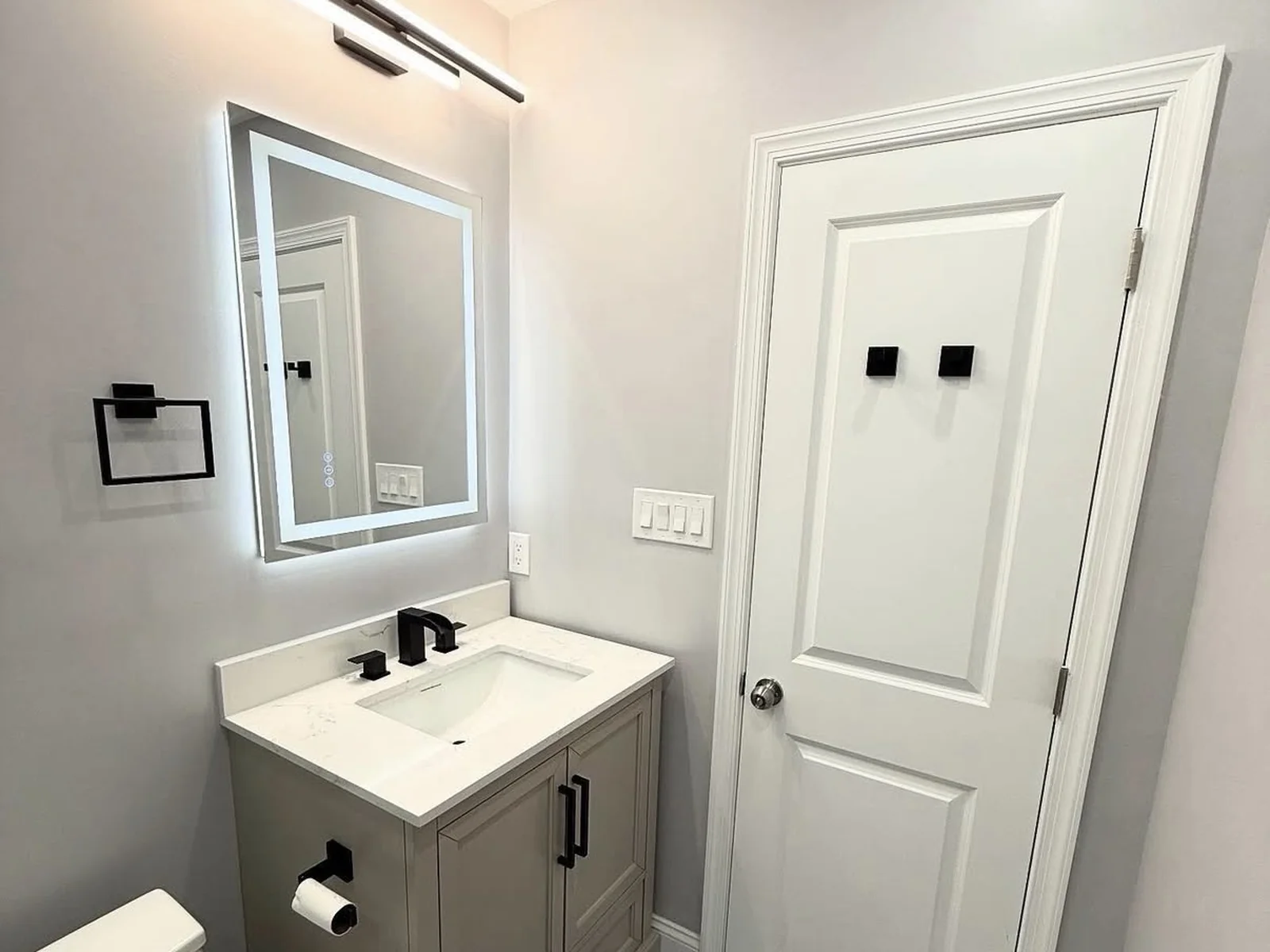 Walk-in tile shower and vanity in a modern Edmond bathroom remodel by MASB Construction