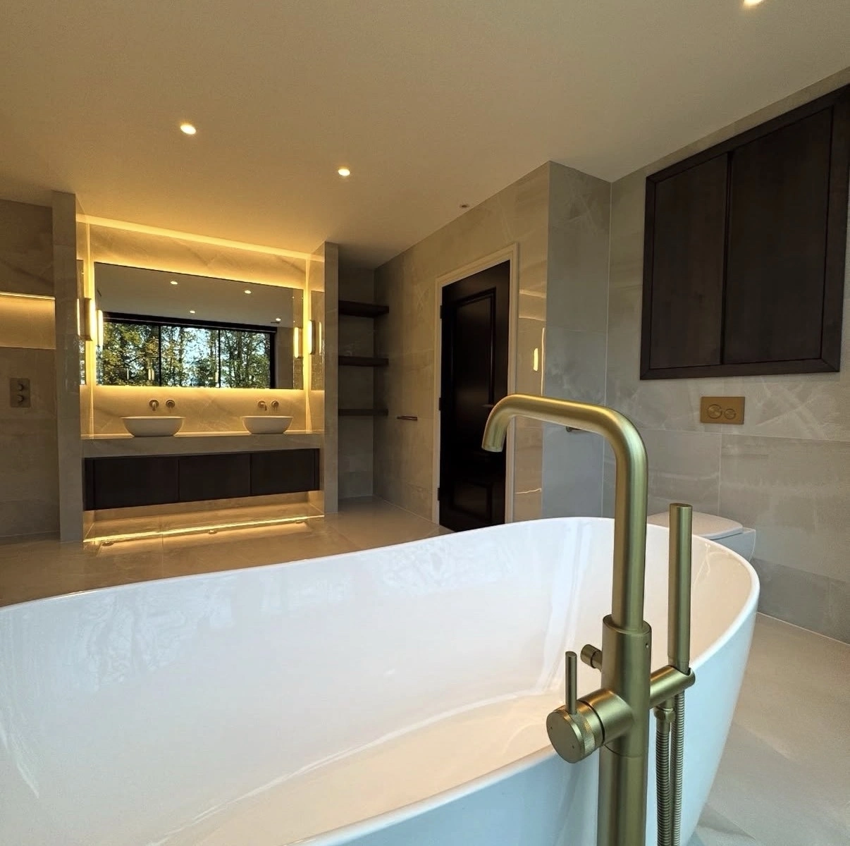 Walk-in shower and custom tile in a spa-style Norman bathroom remodel by MASB Construction