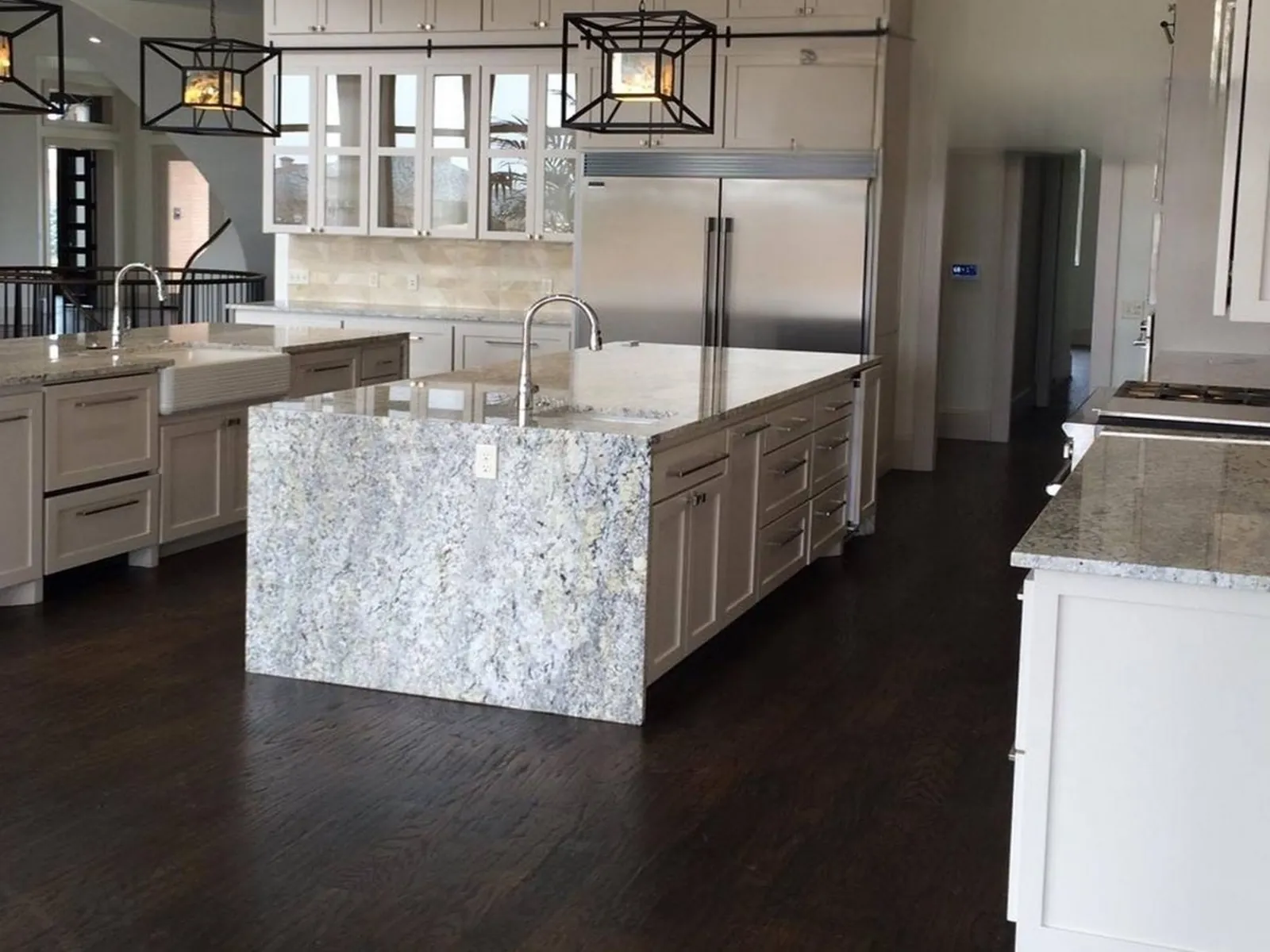 Custom kitchen cabinets and island in an Oklahoma City remodel by MASB Construction