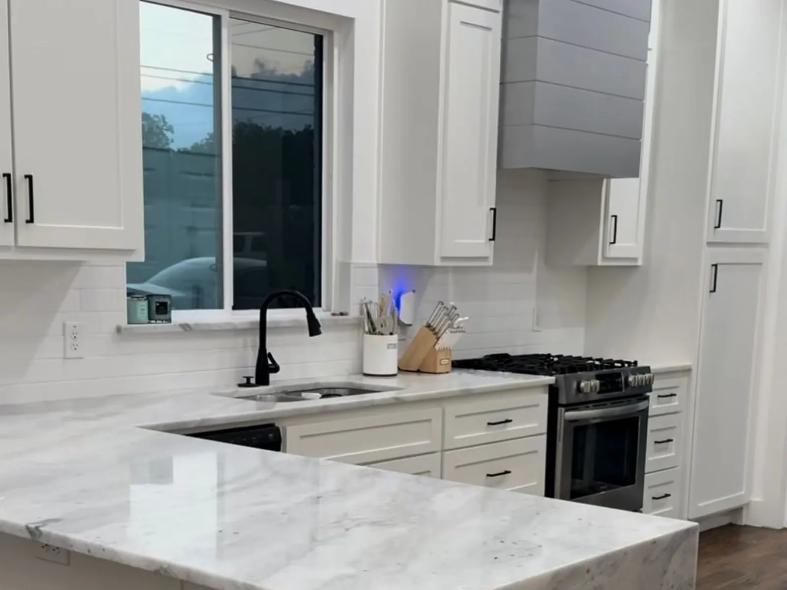 Open layout kitchen renovation detail supporting efficient workflow in Norman by MASB Construction