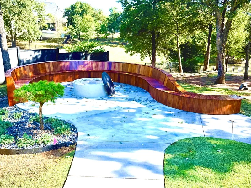 Custom fire pit and curved seating remodel in Edmond