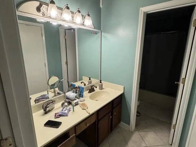 Updated lighting fixtures in Bethany bathroom remodel by MASB Construction