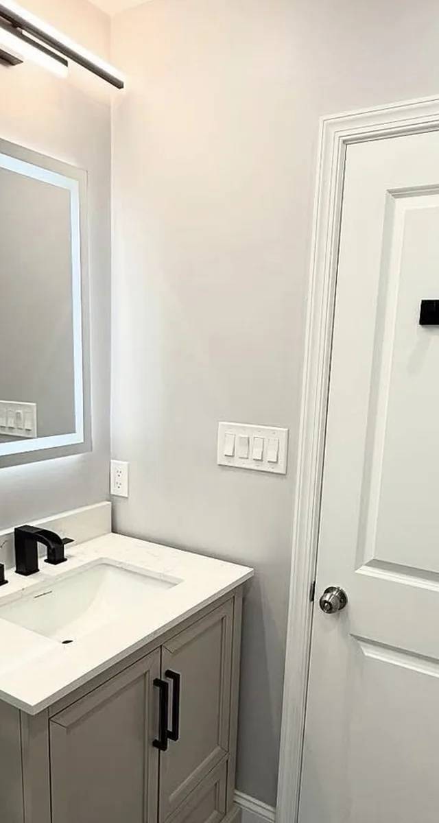 Modern bathroom renovation in Edmond by MASB Construction