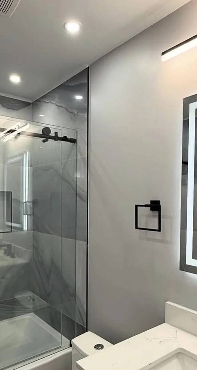 Walk-in shower and vanity detail in Edmond by MASB Construction