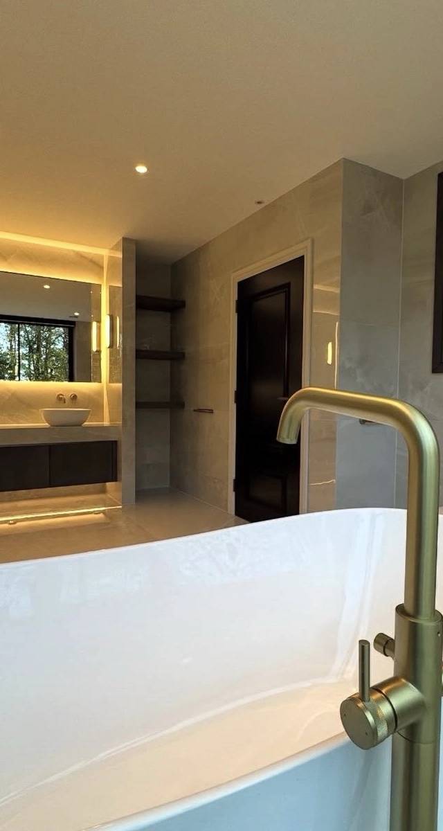 Spa-style bathroom remodel in Norman by MASB Construction