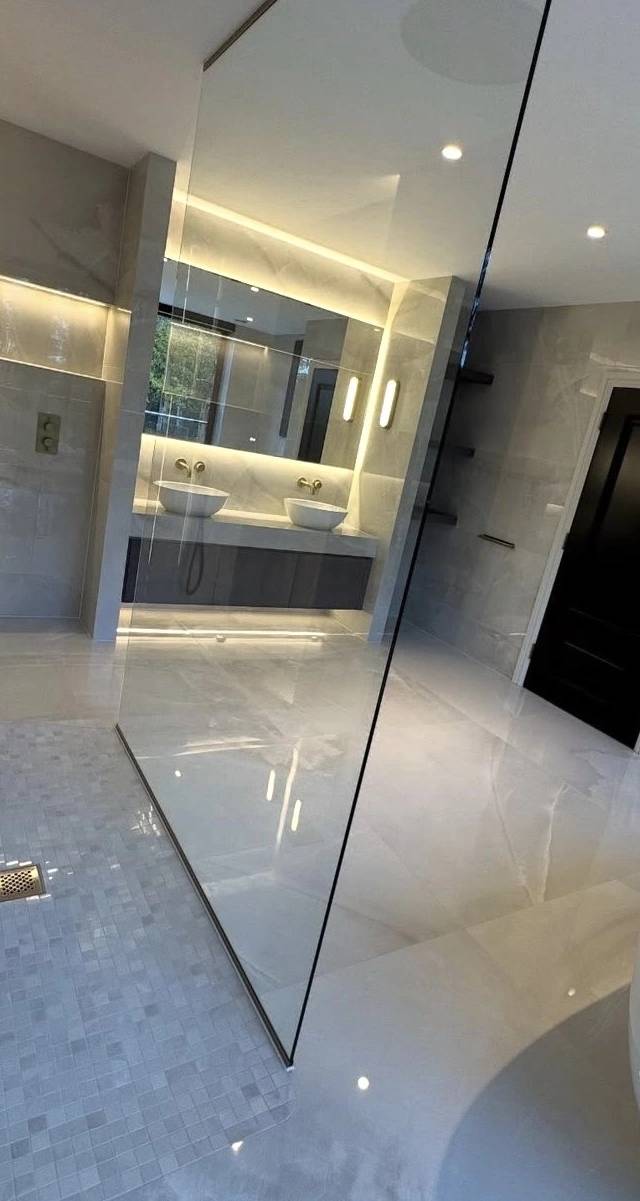 Custom tile bathroom renovation in Norman by MASB Construction