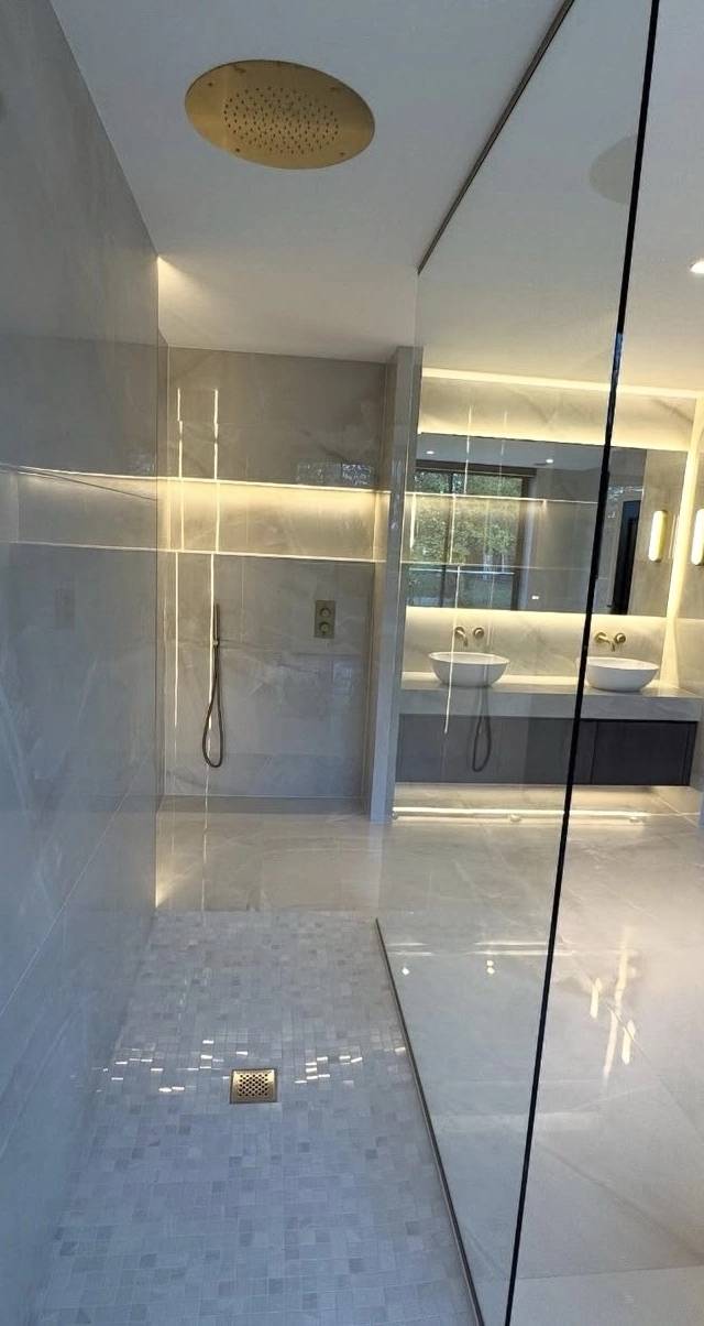 Finished spa-style bathroom remodel in Norman by MASB Construction