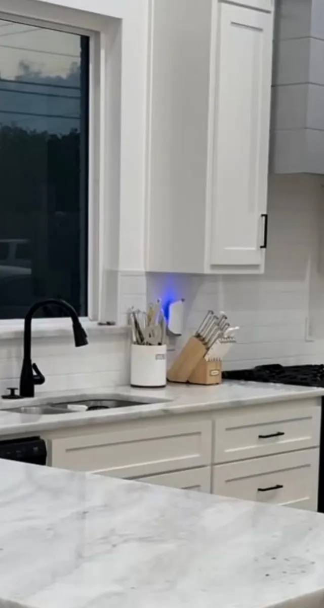 Open layout kitchen renovation detail in Norman by MASB Construction