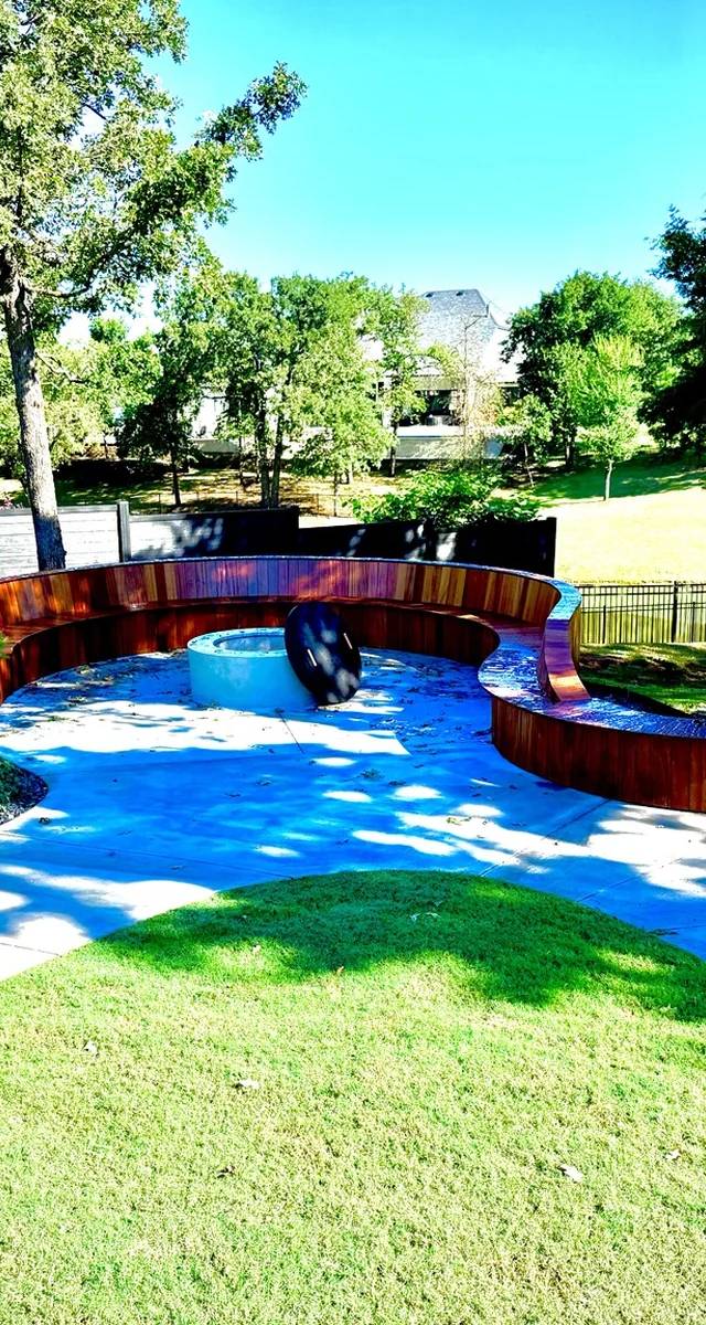 Custom fire pit and curved seating remodel in Edmond by MASB Construction
