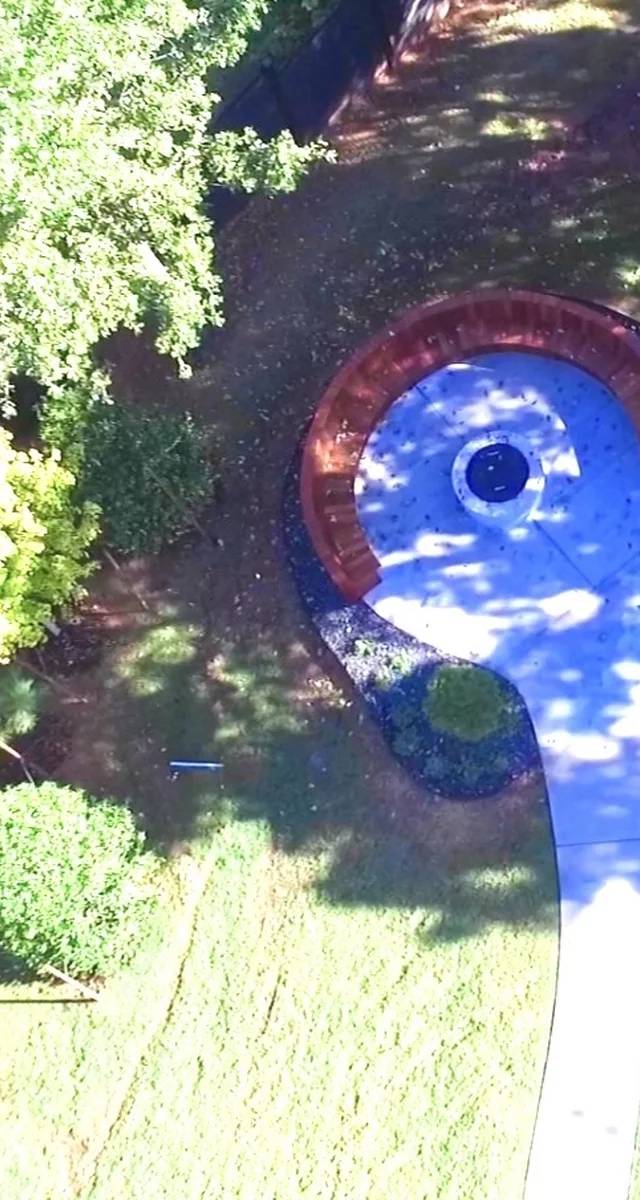Finished fire pit and curved seating outdoor remodel in Edmond by MASB Construction