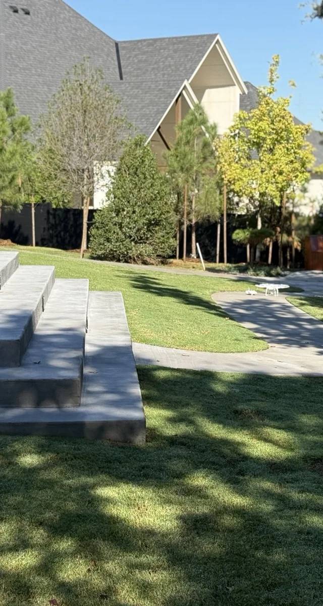 Retaining wall and outdoor gathering space in Edmond by MASB Construction